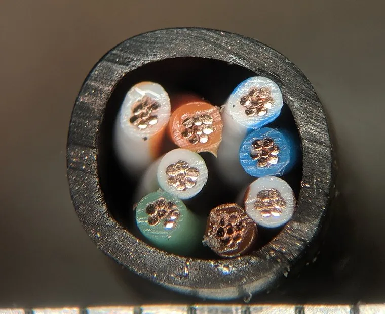 Cut end of a Cat5e cable: four twisted pairs loose in the jacket, no separator